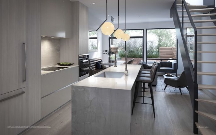 kitchen with modern staircase overlooking greenery and terrace at ultrasonic condos