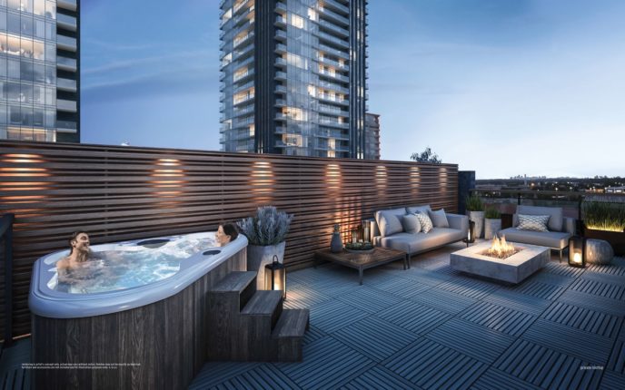 rooftop with hot tub and fire table at ultrasonic condos overlooking two condo buildings